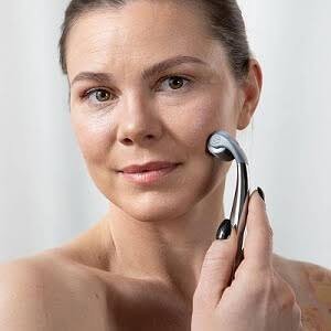 Skin Tightening Treatment in Bhopal using facial massage roller for anti-aging and skin rejuvenation by Dr. Prerna Sharma, Dermatologist and Skin Specialist in Bhopal.